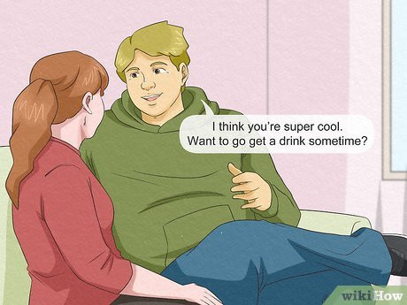 A man and a woman sitting on a couch. The man is asking, "I think you're super cool. Want to go get a drink sometime?"